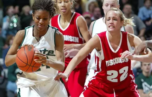 Michigan State's Rene Haynes, left, gets control of the ball against Wisconsin's Christine Spencer (22) during the second half of a college basketball game, Sunday, Feb. 12, 2006, in East Lansing, Mich. Haynes led Michigan State with 14 points in a 53-47 win. (AP Photo/Al Goldis)