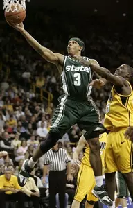 Michigan State's Shannon Brown, left, drives to the basket past Iowa's Mike Henderson during the first half of an NCAA college basketball game, Tuesday, Feb. 14, 2006, in Iowa City, Iowa. (AP Photo/Charlie Neibergall)