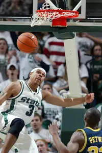 Shannon Brown dunks home two of his game-high 26 points against Michigan. (AP Photo/Al Goldis)