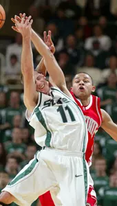Michigan State's Drew Neitzel (11) and Ohio State's Jamar Butler leap for an errant pass. (AP Photo/Al Goldis)