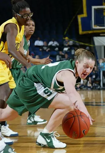 Michigan State's Liz Shimek reaches for a loose ball in front of Michigan's Melinda Queen, left, and Michigan State's Rene Haynes, rear, during the first half of a college basketball game, Thursday, Feb. 23, 2006, in Ann Arbor, Mich. (AP Photo/Al Goldis)