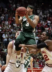 Michigan State's Shannon Brown (3) is defended by Indiana's Ben Allen of Australia, left, and Marshall Strickland as he goes up for a shot. (AP Photo/Darron Cummings)