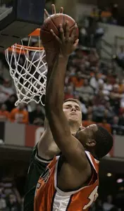 Michigan State center Paul Davis, back, rejects a shot by Illinois forward Shaun Pruitt, front, in the first half of the Big Ten men's basketball tournament Friday, March 10, 2006 in Indianapolis. (AP Photo/Darron Cummings)