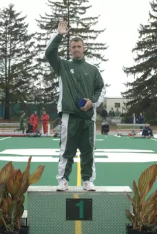 Brad Gebauer accepts his first-place medal at the 2006 Big Ten Outdoor Championships in East Lansing.