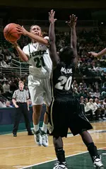 Spartan guard Mia Johnson drives to the basket past Purdue defender