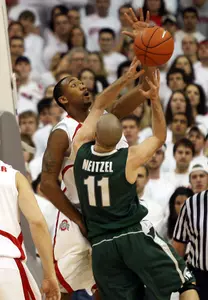 Drew Neitzel has his shot blocked by Ohio State's David Lighty, rear, during the first half.