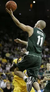 Drew Neitzel shoots over Iowa's Cyrus Tate. (AP Photo)