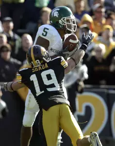 Devin Thomas pulls down a pass in front of Iowa's Adam Shada. Shada was also called for pass interference on the play. (AP Photo/Brian Ray)