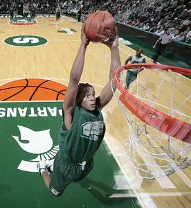 Chris Allen dunks two of his 21 points in the Green-White scrimmage on Sunday.