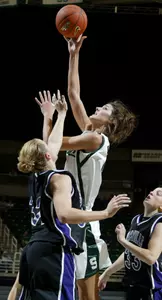 Allyssa DeHaan shoots between Evansville's Shannon Novosel, left, and Rebekah Parker during the second half. DeHaan led Michigan State with 16 points, nine rebounds and eight blocked shots in a 73-53 win. (AP Photo/Al Goldis)