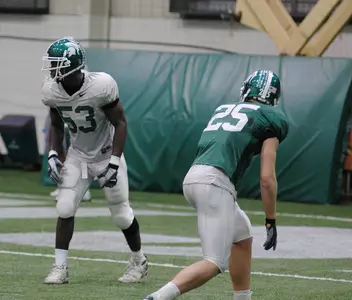 Freshman linebacker Greg Jones participates in 7-on-7 passing drills during Saturday's practice.
