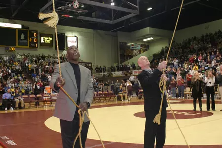 Tom Minkle unveils his banner in Rose Arena at Central Michigan in his singlet retirement ceremony.
