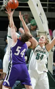 Aisha Jefferson blocks a shot by Northwestern's Kaitlin McInerney as Laura Hall, right, defends during the first half.