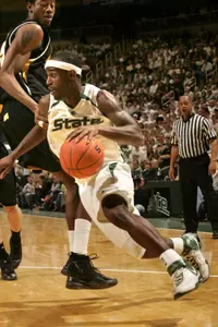 Travis Walton and the Spartans host Wisconsin on Tuesday night.