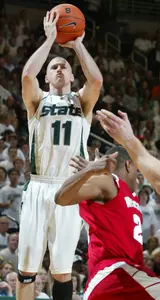 Drew Neitzel shoots a 3-pointer over Wisconsin's Michael Flowers.