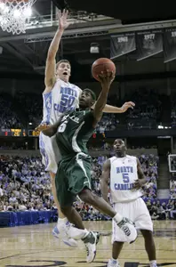 Travis Walton goes to the hoop against North Carolina's Tyler Hansbrough. (AP Photo/David J. Phillip)