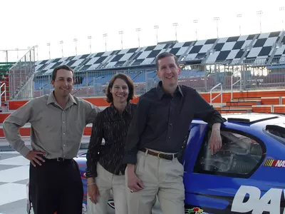 Spartan coaches, assistant Lorne Don and head coach Stacy Slobodnik-Stoll, pose at the Daytona Speedway, site of NASCAR's Daytona 500.