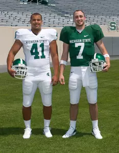 Linebacker Kaleb Thornhill and quarterback Brian Hoyer model the new uniforms.