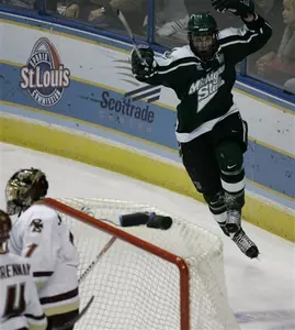 Justin Abdelkader celebrates the game-winning goal in the NCAA title game