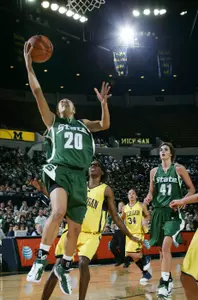 Brittney Thomas scores two of her eight points Sunday afternoon at Crisler Arena.