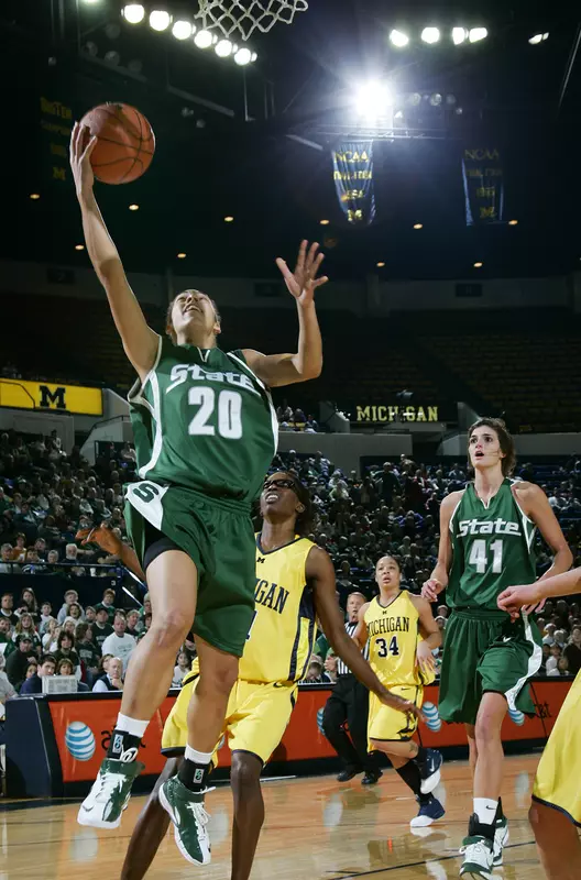 Brittney Thomas scores two of her eight points Sunday afternoon at Crisler Arena.