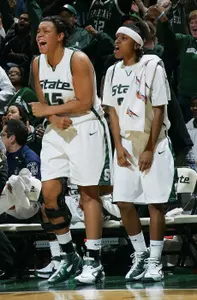 Lauren Aitch and Takeya Fortner celebrate during MSU's win over Michigan Thursday night at the Breslin Center.