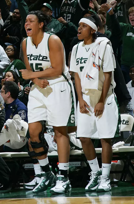 Lauren Aitch and Takeya Fortner celebrate during MSU's win over Michigan Thursday night at the Breslin Center.