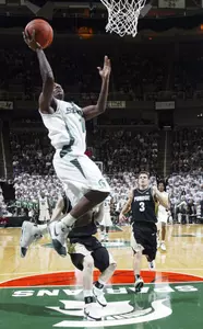 Michigan State's Kalin Lucas, left, puts up a fast-break layup against Purdue's Chris Kramer. (AP Photo/Al Goldis)