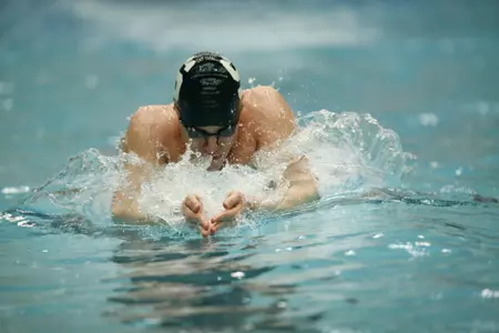 Kevin Puskaric won the 100 breast and 200 breast.