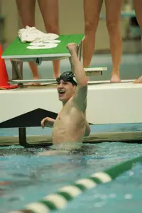 Kevin Puskaric set a pool record in winning the 100 breaststroke in a time of 56.12.