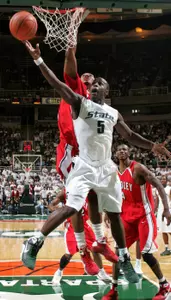 Travis Walton puts up a shot in front of Bradley's Chris Roberts during the first half.