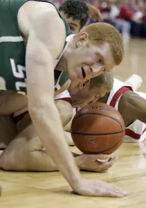 Drew Naymick fights for a loose ball with Wisconsin's Brian Butch. (AP Photo/Andy Manis)