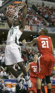 Marquise Gray dunks as Ohio State's Evan Turner and Kosta Koufos watch. (AP Photo/Darron Cummings)