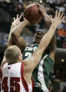 Raymar Morgan goes up for a shot against Wisconsin's Joe Krabbenhoft during the first half. (AP Photo/Michael Conroy)