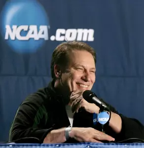 Spartan head coach Tom Izzo enjoys a laugh during Thursday's NCAA Tournament press conference. (Photo by Dale Young, The Detroit News)