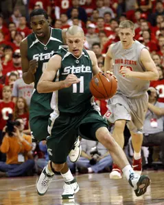 Michigan State's Drew Neitzel (11) brings the ball up court during the first half against Ohio State. (AP Photo/Terry Gilliam)