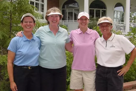 Stacy Slobodnik-Stoll (second from the right) posed with former Spartans Joan Garety, Sue Keller and Sue Ertl after yesterday's sectional qualifier.