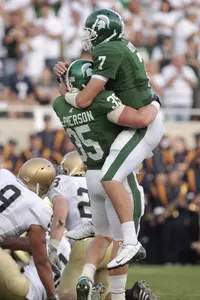 Brian Hoyer celebrates after Michigan State defeated Notre Dame, 23-7, last Saturday at Spartan Stadium.