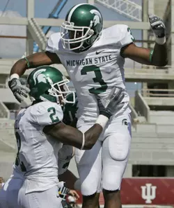 Mark Dell is congratulated by B.J. Cunningham after scoring a touchdown against Indiana during the second quarter. (AP Photo/Darron Cummings)