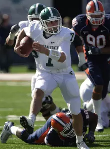 Keith Nichol runs over Illinois' Sirod Williams during the first half. (AP Photo/Seth Perlman)