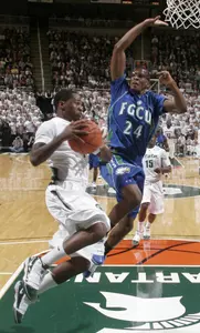 Kalin Lucas drives to the basket as Florida Gulf Coast's Derrick O'Neil defends during the first half.