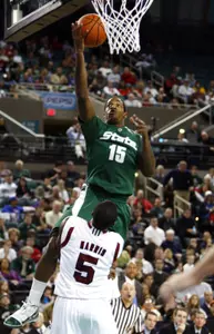 Michigan State's Durrell Summers (15) shoots over Massachusetts' Ricky Harris (5). (AP)