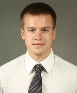 Ivan Zalessov won the one-meter competition on Saturday with a school-record 356.63.