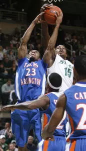 Texas-Arlington's Brandon Long (23) and Durrell Summers (15) reach for a rebound during the first half.