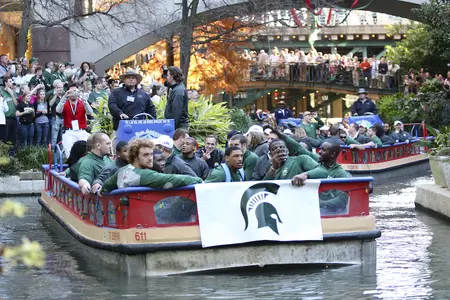 The Spartans cruise on the river on their way to the pep rally Thursday afternoon.