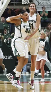 Redshirt junior Lauren Aitch (left) celebrates her game-winning shot with junior Allyssa DeHaan.