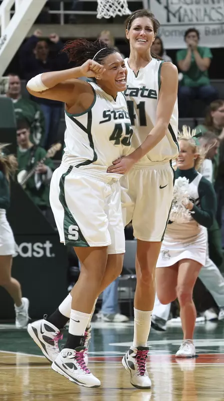 Redshirt junior Lauren Aitch (left) celebrates her game-winning shot with junior Allyssa DeHaan.
