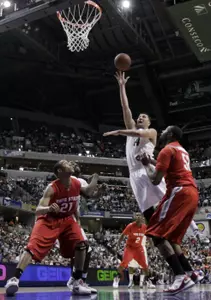 Goran Suton shoots against Ohio State's Evan Turner and Dallas Lauderdale in the first half. (AP Photo/Darron Cummings)