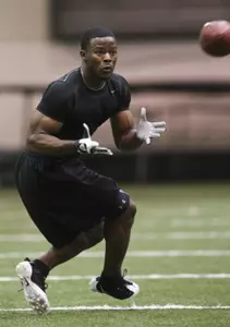 Javon Ringer catches a pass from Brian Hoyer at Wednesday's pro day.