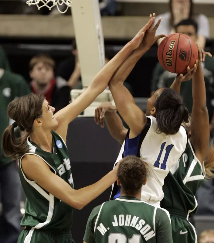 Allyssa DeHaan blocks a shot by Duke forward Chante Black during the first half. (AP Photo/Carlos Osorio)